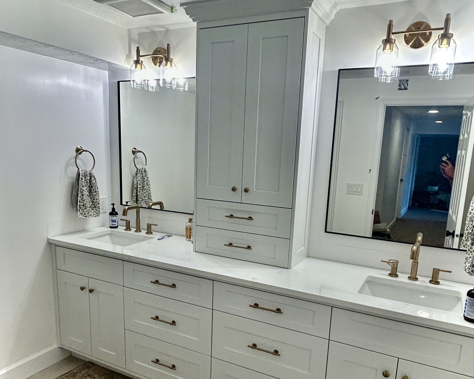 Bathroom remodel with double vanity and marble surround