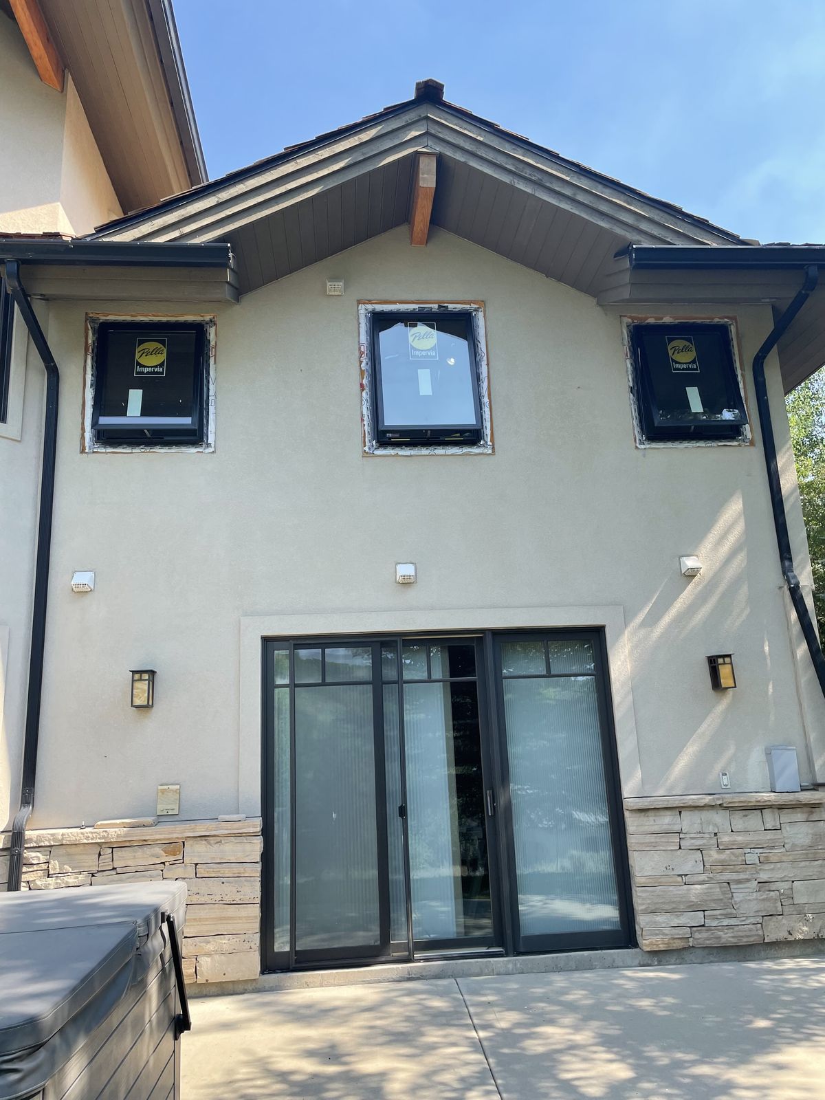 New windows and finished stucco exterior
